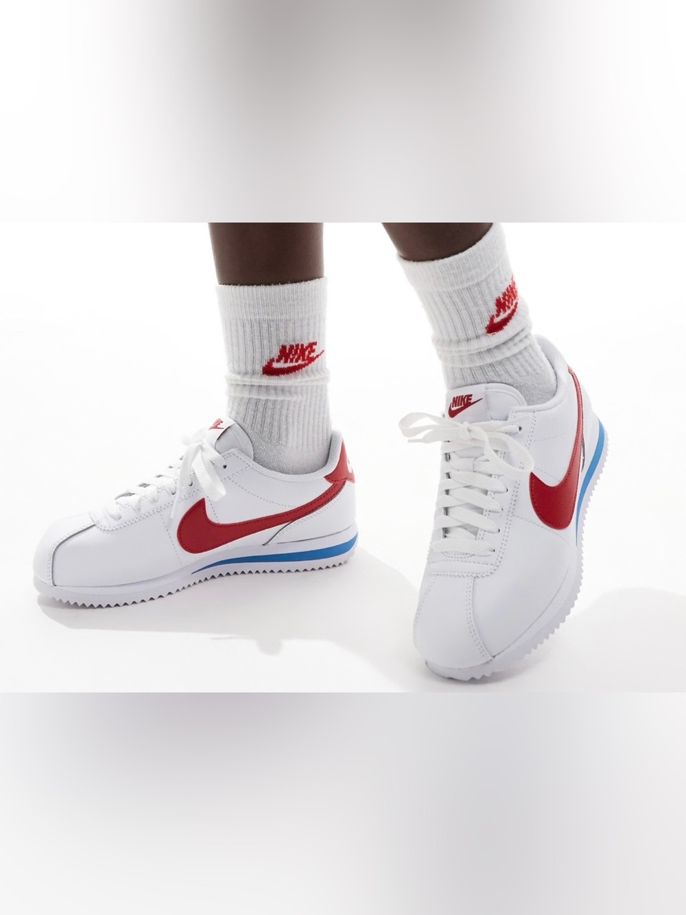 Nike White Sneakers with Red Swoosh and Blue Accent